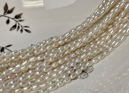 4x6.5-7 mm AA Tiny White Long Rice Oval Freshwater Pearls Long Oval Shape Seed Beads #1413