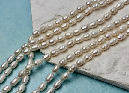 5-5.5x7-10mm Natural White Rice/Oval Freshwater Pearls Beads 14 Inch Strand #P3529