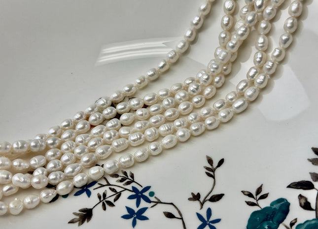 5-5.5x7-10mm Natural White Rice/Oval Freshwater Pearls Beads 14 Inch Strand #P3529