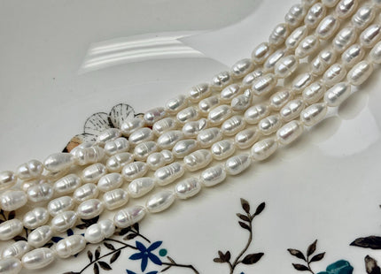 5-5.5x7-10mm Natural White Rice/Oval Freshwater Pearls Beads 14 Inch Strand #P3529