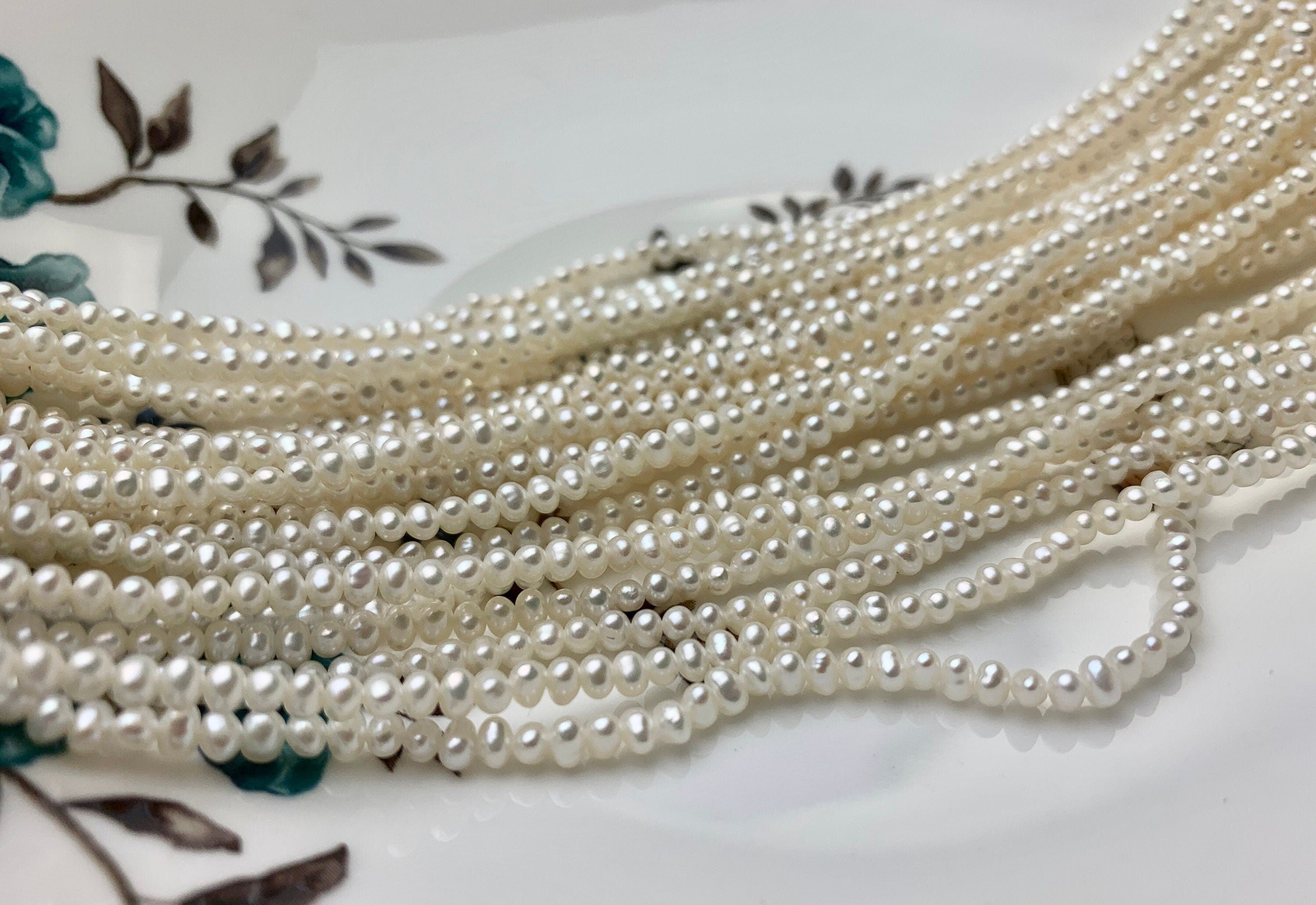 Wholesale Near Round White Natural Freshwater Pearl A / AA / AAA